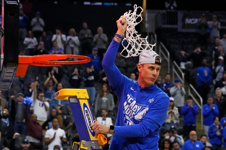 Duke Blue Devils head coach Jon Scheyer cuts down the net after the Duke Blue Devils beat the Alabama Crimson Tide in the East Regional final of the 2025 NCAA tournament at Prudential Center.