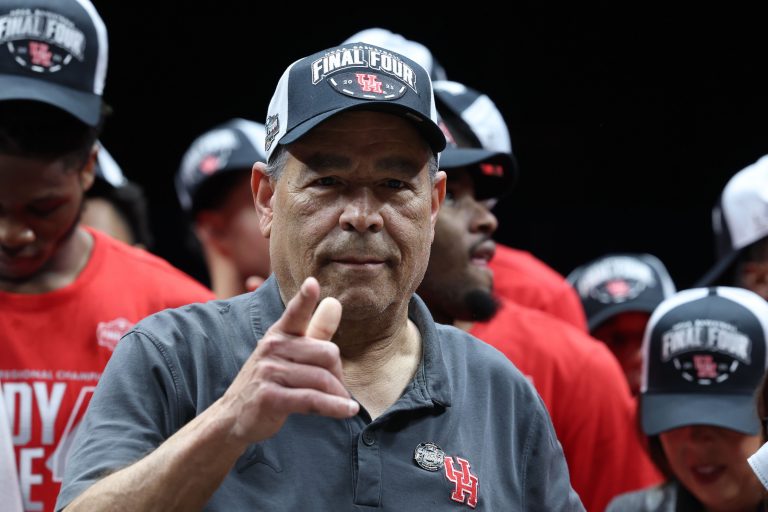 Houston Cougars head coach Kelvin Sampson reacts on stage after defeating the Tennessee Volunteers during the Midwest Regional final of the 2025 NCAA tournament at Lucas Oil Stadium.