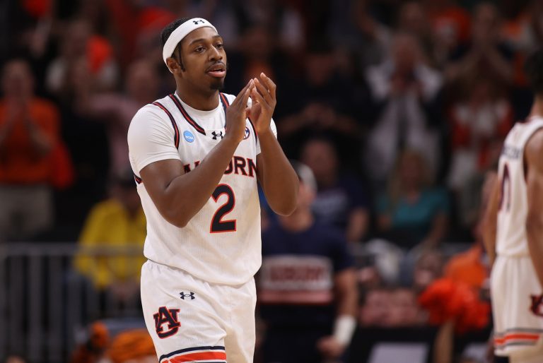 Auburn Tigers guard Denver Jones (2) celebrates after a play during the first half in the South Regional final of the 2025 NCAA tournament against the Michigan State Spartans at State Farm Arena.
