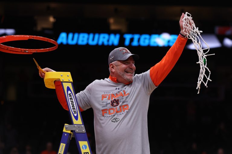 Auburn Tigers head coach Bruce Pearl cuts down the net after winning the South Regional final of the 2025 NCAA tournament against the Michigan State Spartans at State Farm Arena.