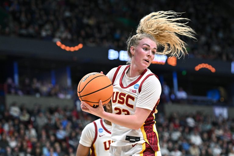 USC Trojans guard Avery Howell (23) rebounds against the UConn Huskies during the first half of a Elite 8 NCAA Tournament basketball game at Spokane Arena.