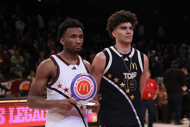 McDonald's All American West guard Darryn Peterson (22) and McDonald's All American East forward Cameron Boozer (12) pose for photos after the game at Barclays Center.
