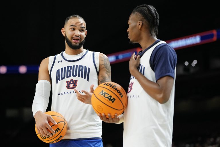 Auburn Tigers forward Johni Broome (4) talks with guard Miles Kelly (13) during a practice session for the Final Four of the 2025 NCAA tournament at Alamodome.