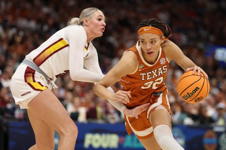 Texas Longhorns guard Ndjakalenga Mwenentanda (32) drives against South Carolina Gamecocks forward Chloe Kitts (21) during the first half in a semifinal of the women's 2025 NCAA tournament at Amalie Arena.