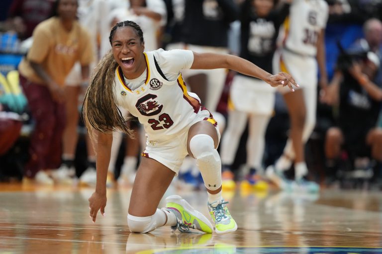 South Carolina Gamecocks guard Bree Hall (23) trips during her celebration during the third quarter in a semifinal of the women's 2025 NCAA tournament against the Texas Longhorns at Amalie Arena.