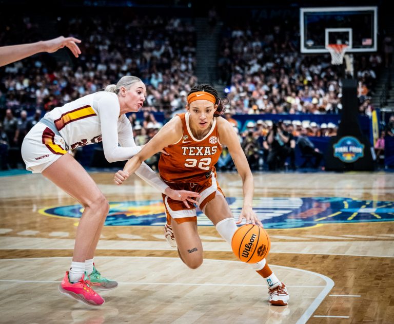 Texas Longhorns guard Ndjakalenga Mwenentanda (32) drives past defense from South Carolina Gamecocks forward Chloe Kitts (21) in the first half of the Longhorns' NCAA Playoff semi-final game against the South Carolina Gamecocks at Amalie Arena