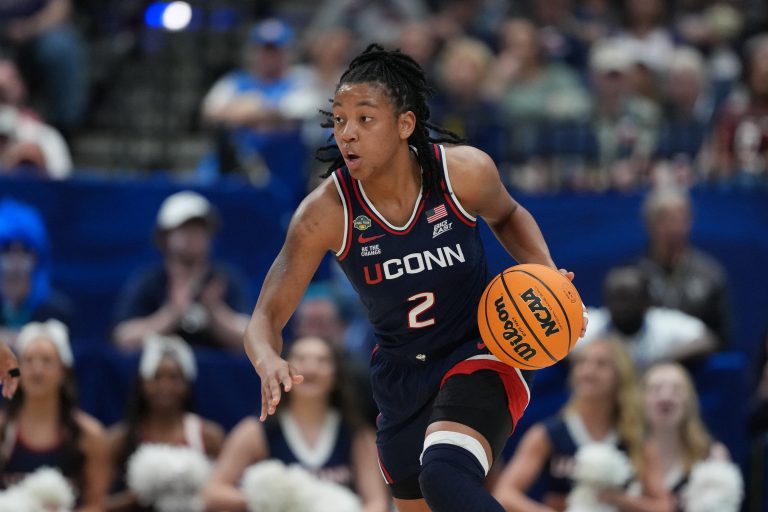 Connecticut Huskies guard KK Arnold (2) dribbles against the UCLA Bruins during the third quarter in a semifinal of the women's 2025 NCAA tournament at Amalie Arena.