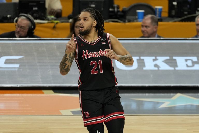 Houston Cougars guard Emanuel Sharp (21) reacts after making a three point basket against the Duke Blue Devils during the second half in the semifinals of the men's Final Four of the 2025 NCAA Tournament at Alamodome.
