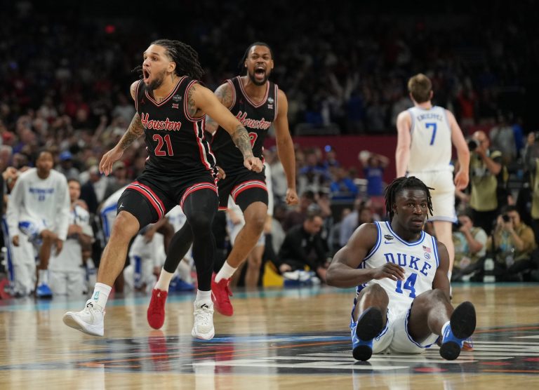 Houston Cougars guard Emanuel Sharp (21) and Houston Cougars forward J'Wan Roberts (13) celebrate defeating the Duke Blue Devils in the semifinals of the men's Final Four of the 2025 NCAA Tournament at the Alamodome.