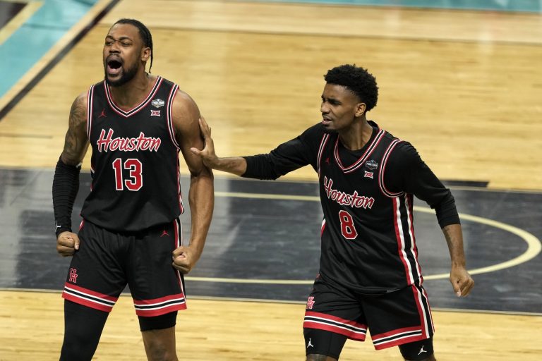 Houston Cougars forward J'Wan Roberts (13) and guard Mylik Wilson (8) react against the Duke Blue Devils during the second half in the semifinals of the men's Final Four of the 2025 NCAA Tournament at Alamodome.
