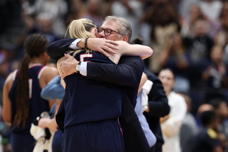 Connecticut Huskies head coach Geno Auriemma hugs guard Paige Bueckers (5) during the second half against the South Carolina Gamecocks of the national championship of the women's 2025 NCAA tournament at Amalie Arena.