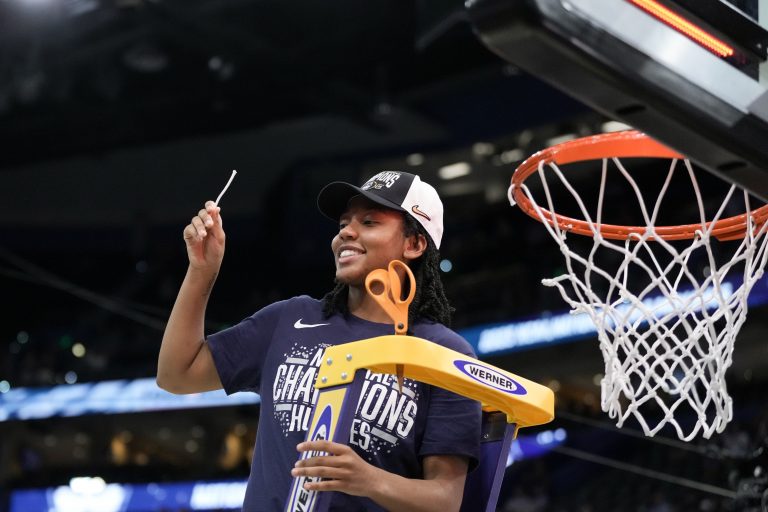 Connecticut Huskies guard KK Arnold (2) holds up a piece of the net after the national championship of the women's 2025 NCAA tournament against the South Carolina Gamecocks at Amalie Arena.