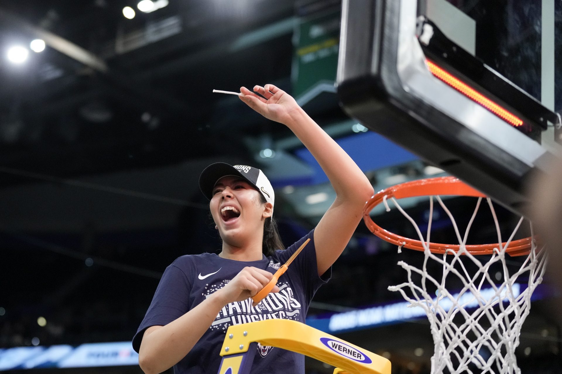 Connecticut Huskies center Jana El Alfy (8) holds up a piece of the net after the national championship of the women's 2025 NCAA tournament against the South Carolina Gamecocks at Amalie Arena.