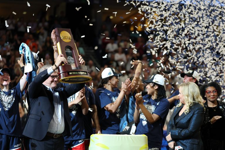 Connecticut Huskies head coach Geno Auriemma holds up the trophy after the national championship of the women's 2025 NCAA tournament against the South Carolina Gamecocks at Amalie Arena.