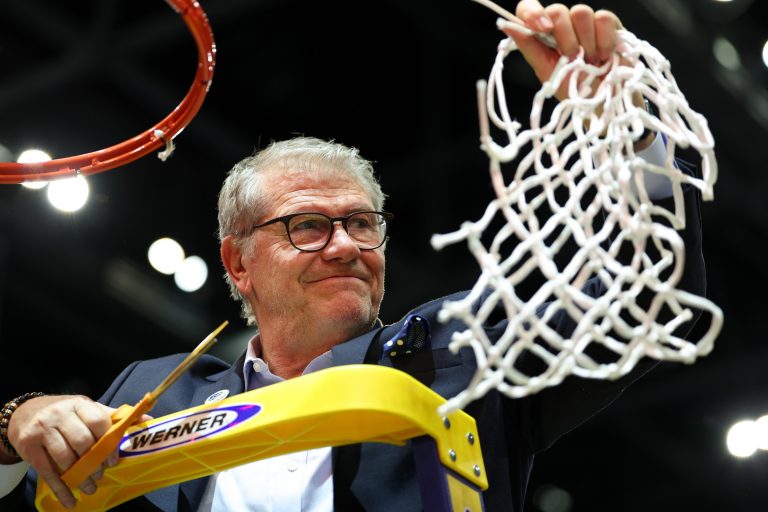 Connecticut Huskies head coach Geno Auriemma cuts off the net after the national championship of the women's 2025 NCAA tournament against the South Carolina Gamecocks at Amalie Arena.