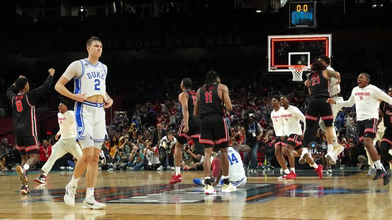 Duke Blue Devils forward Cooper Flagg (2) walks off the court as Houston Cougars players celebrate after Houston’s semifinal win in the men's 2025 NCAA tournament at Alamodome.