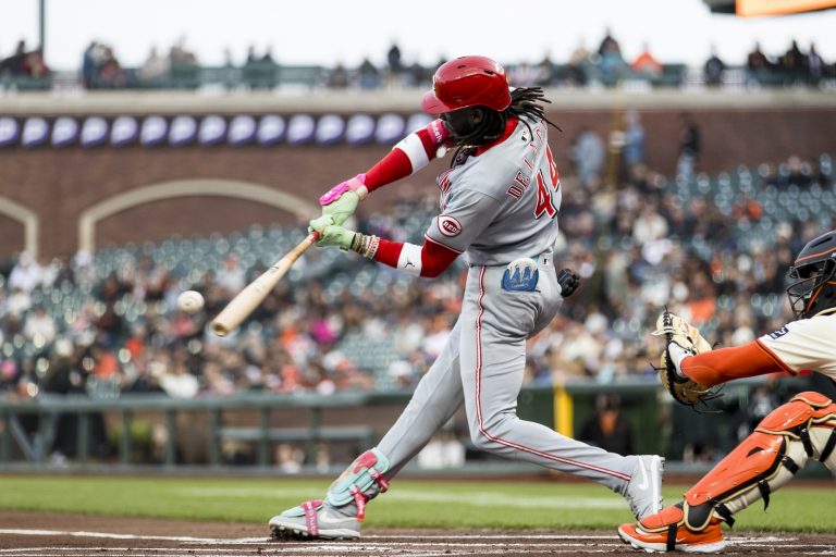 Cincinnati Reds shortstop Elly De La Cruz (44) hits a single against the San Francisco Giants during the first inning at Oracle Park.