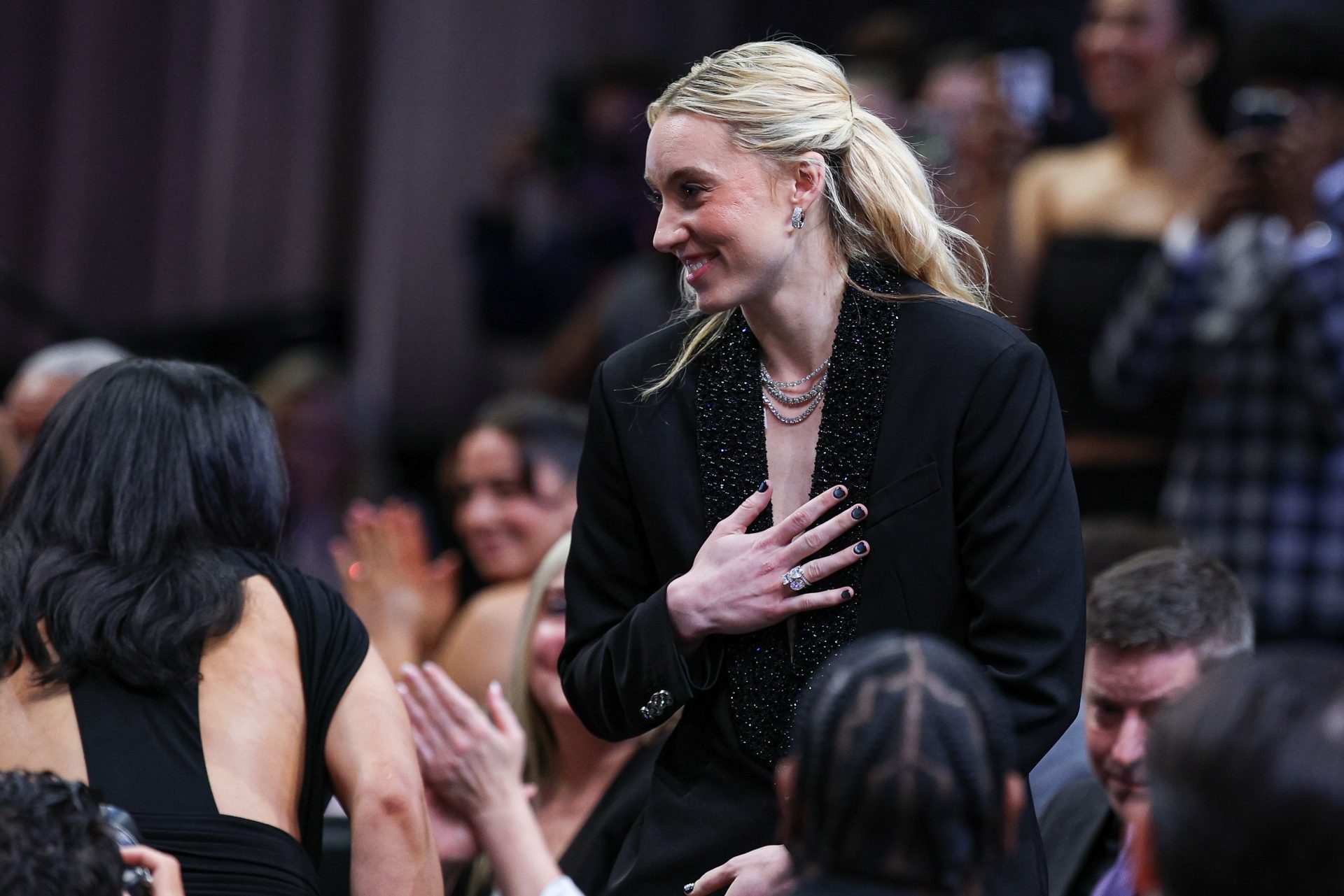 Paige Bueckers reacts after being selected with the number one overall pick to the Dallas Wings in the 2025 WNBA Draft at The Shed at Hudson Yards.