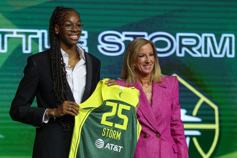 Dominique Malonga poses with WNBA commissioner Cathy Engelbert after being selected with the number two overall pick to the Seattle Storm in the 2025 WNBA Draft at The Shed at Hudson Yards
