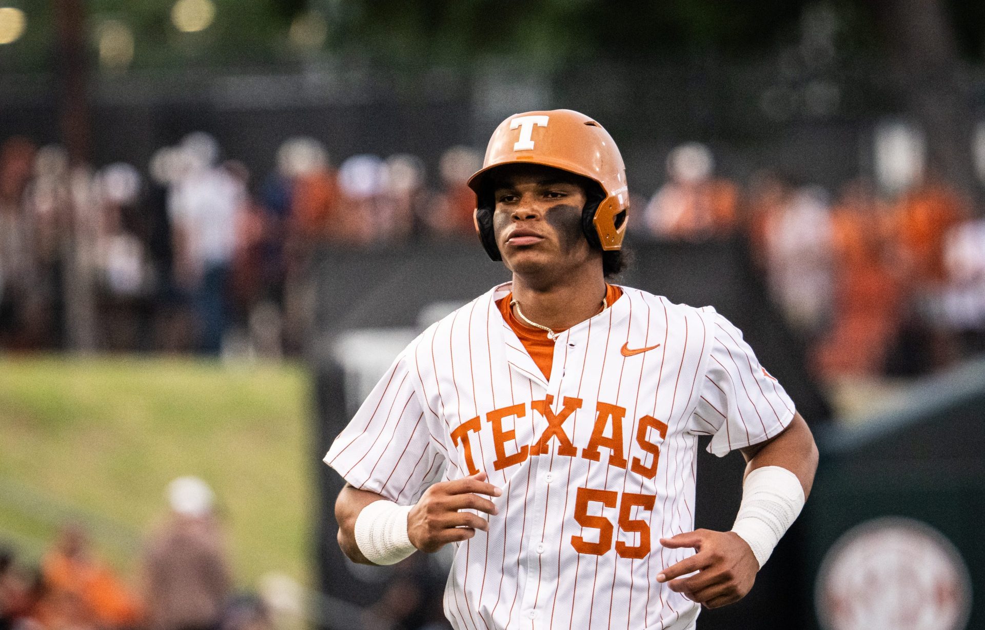 Texas Longhorns outfielder Jonah Williams (55) runs in from the outfield in the fourth inning as the Longhorns play the Auburn Tigers in the second game of a three-game series on Friday night at UFCU Disch-Falk Field in Austin, April 18, 2025.