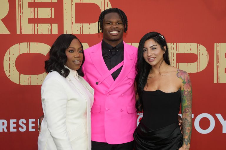Colorado Buffaloes wide receiver Travis Hunter with his mother Ferrante Harris and his fiancee Leanna Lenee on the red carpet before the 2025 NFL Draft at Lambeau Field.