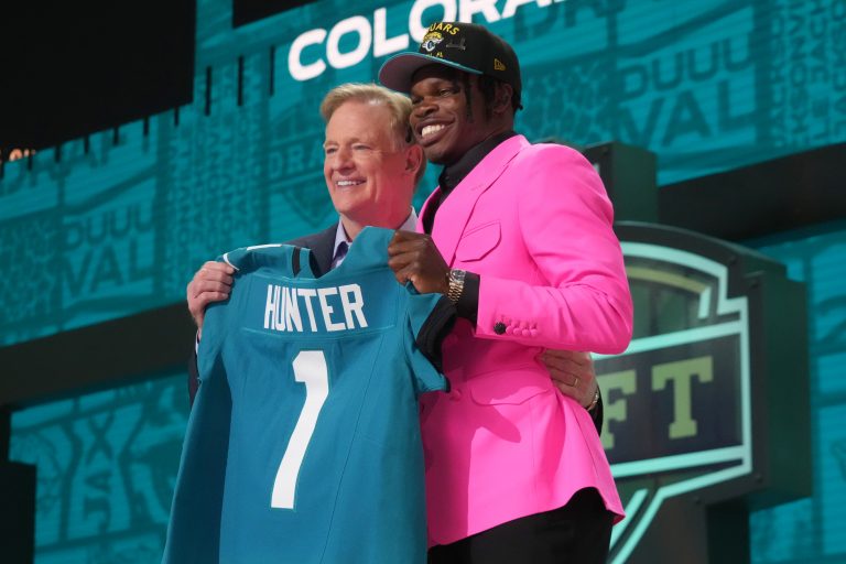 NFL commissioner Roger Goodell stands with Colorado Buffaloes wide receiver Travis Hunter after he is selected by the Jacksonville Jaguars as the number two pick in the first round of the 2025 NFL Draft