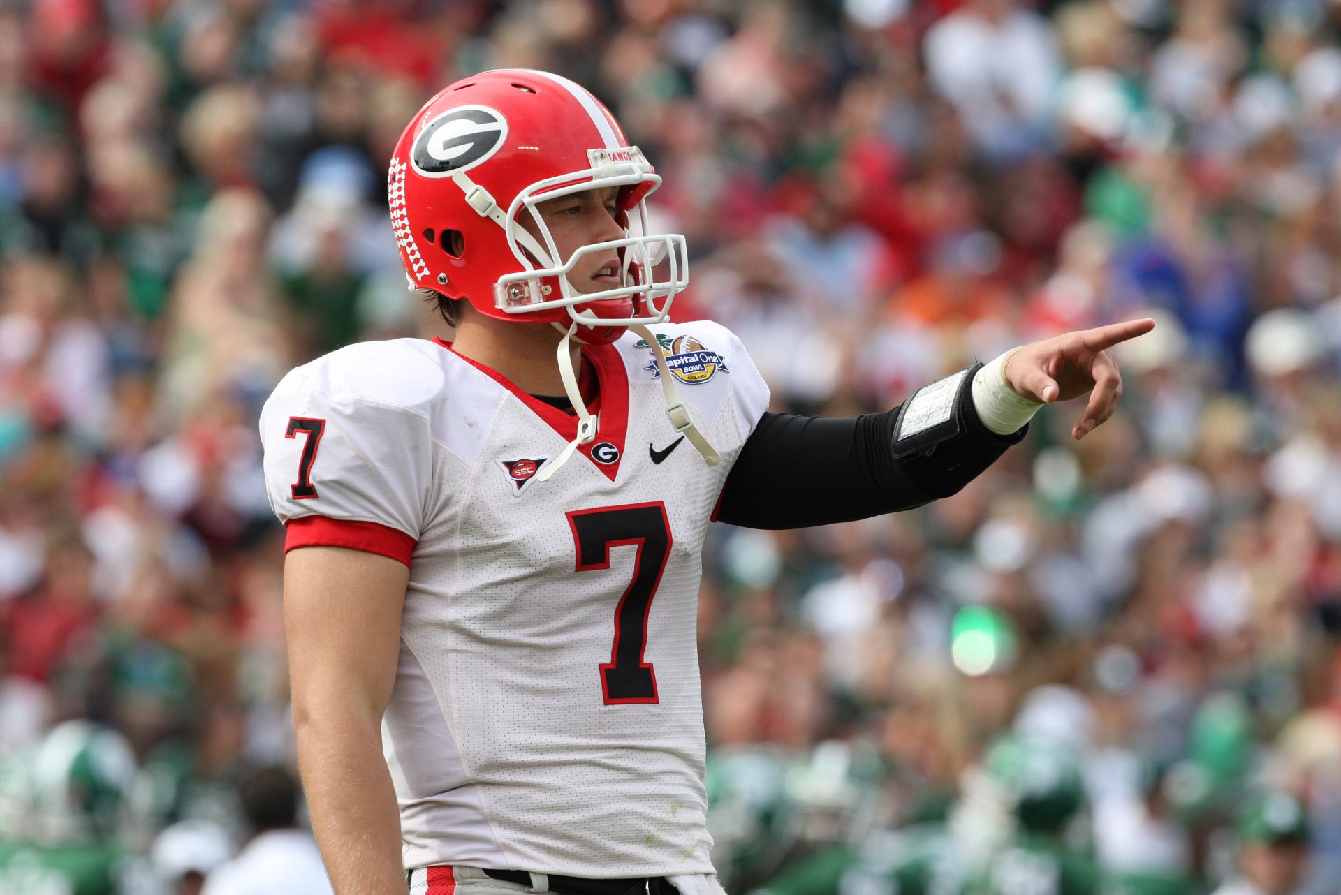 Georgia Bulldogs quarterback Matthew Stafford (7) points to the sidelines in the second quarter against the Michigan State Spartans at Florida Citrus Bowl Stadium.