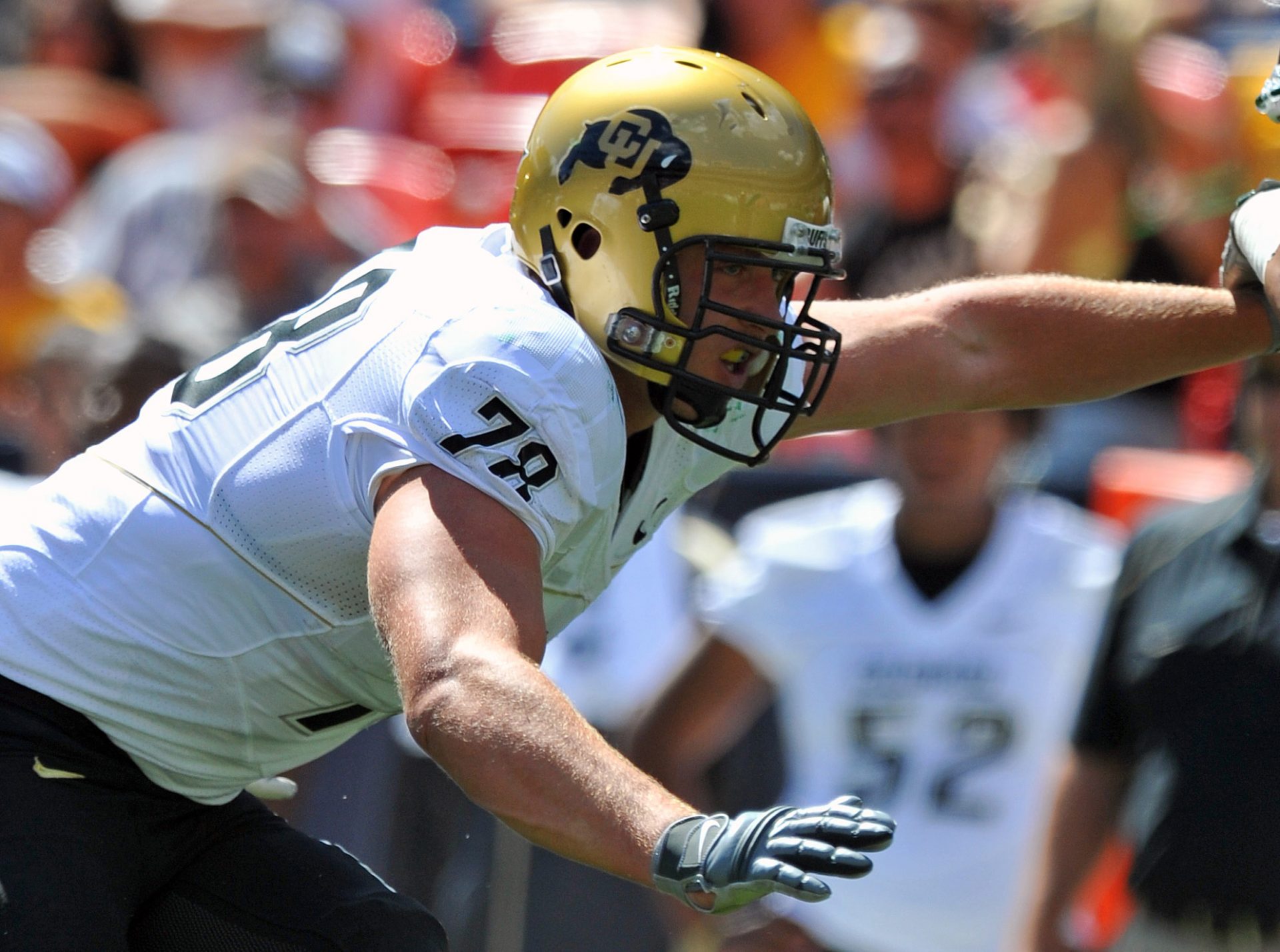 Colorado Buffaloes tackle Nate Solder (78) blocks during the game against the Colorado State Rams in the second half at Invesco Field. The Buffaloes defeated the Rams 24-3.