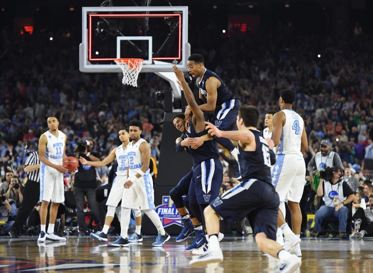 Villanova Wildcats forward Kris Jenkins (2) celebrates with teammates after making the game-winning shot against the North Carolina Tar Heels in the championship game of the 2016 NCAA Men's Final Four at NRG Stadium.