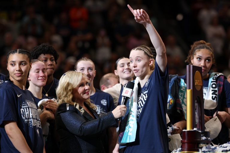 Connecticut Huskies guard Paige Bueckers (5) is interviewed by ESPN reporter Holly Rowe after the national championship of the women's 2025 NCAA tournament against the South Carolina Gamecocks at Amalie Arena.