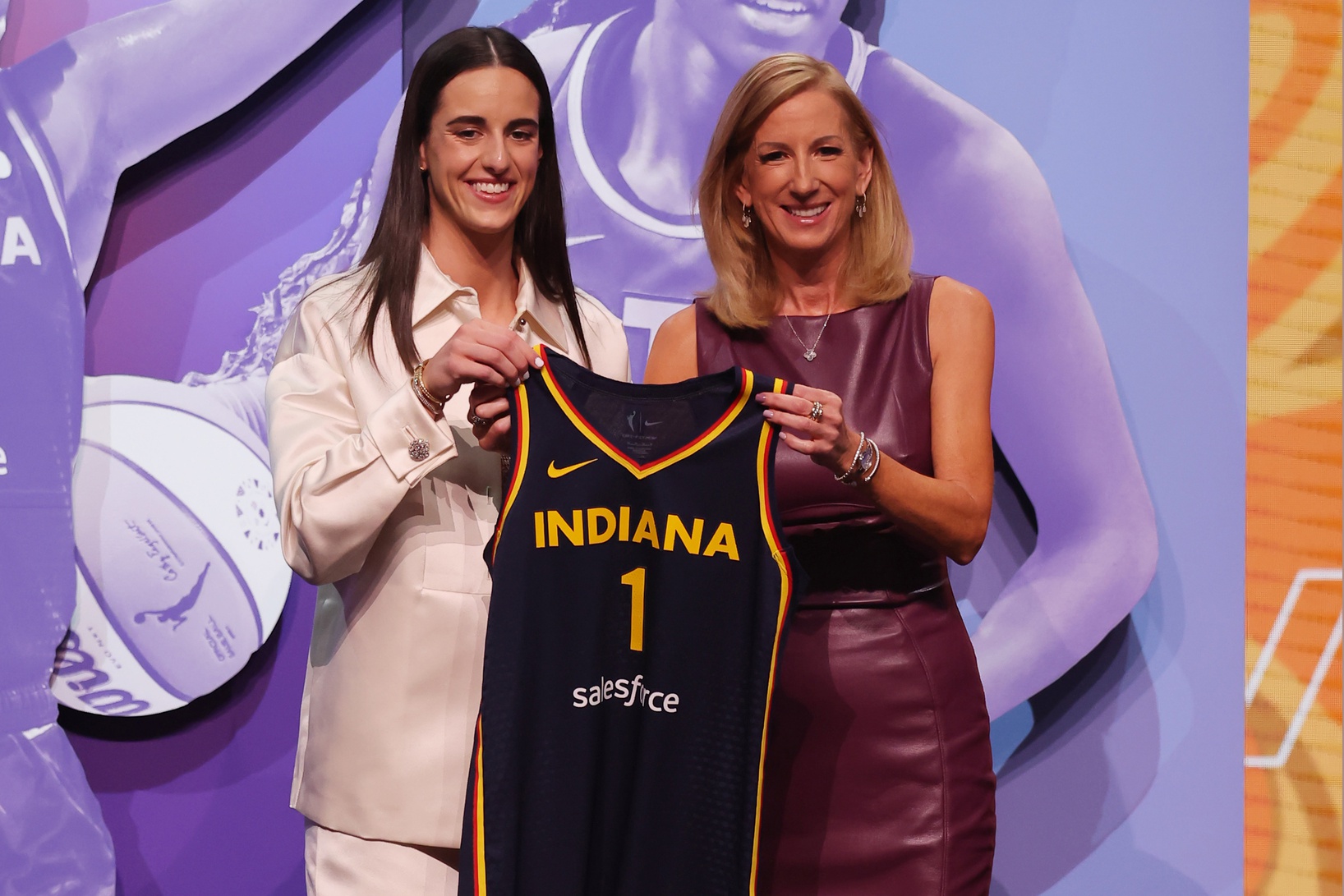 Caitlin Clark poses with WNBA commissioner Cathy Engelbert after she is selected with the number one overall pick to the Indiana Fever in the 2024 WNBA Draft at Brooklyn Academy of Music.