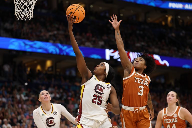 South Carolina Gamecocks guard Raven Johnson (25) shoots against Texas Longhorns guard Rori Harmon (3) during the third quarter in a semifinal of the women's 2025 NCAA tournament at Amalie Arena.