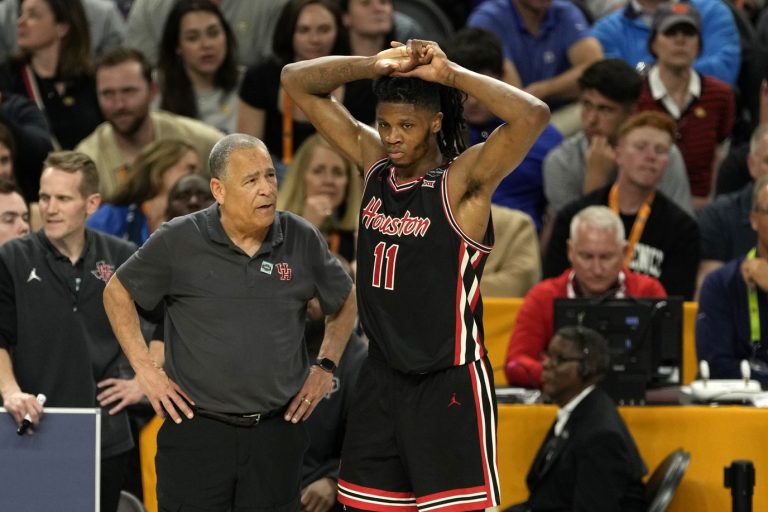 Houston Cougars head coach Kelvin Sampson talks with forward Joseph Tugler (11) after getting a technical foul during the second half in the semifinals of the men's Final Four of the 2025 NCAA Tournament at Alamodome.