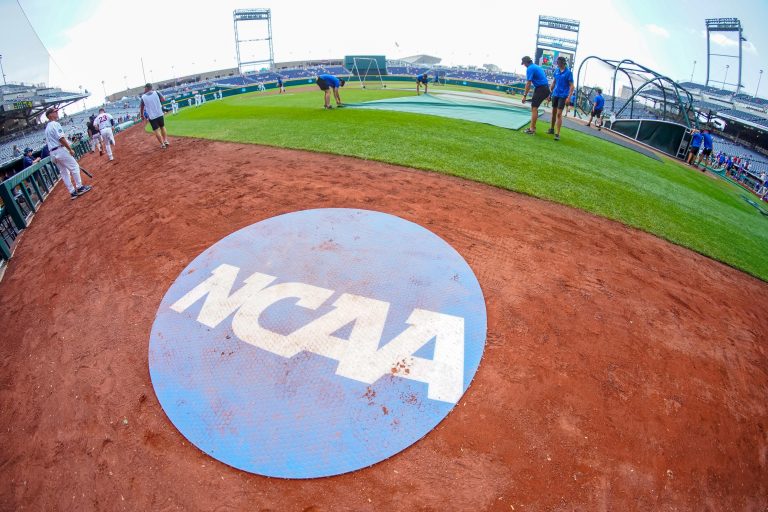 An on-deck circle with the NCAA logo is pictured on the field before the game between the Virginia Cavaliers and the TCU Horned Frogs at Charles Schwab Field Omaha.