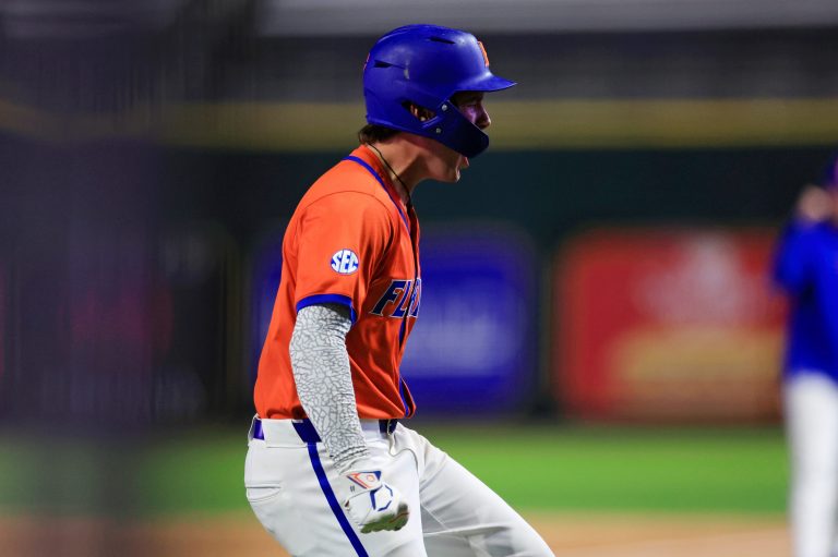Florida infielder Brendan Lawson (11) reacts to scoring during the ninth inning of an NCAA college baseball matchup Tuesday, March 25, 2025 at VyStar Ballpark in Jacksonville, Fla. FSU rallied to defeat UF 8-4 off a walk-off grand slam from Alex Lodise in the ninth inning. [Corey Perrine/Florida Times-Union]