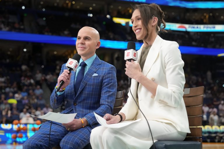ESPN announcers Ryan Ruocco and Rebecca Lobo look on before the national championship of the women's 2025 NCAA tournament between the South Carolina Gamecocks and the Connecticut Huskies at Amalie Arena.