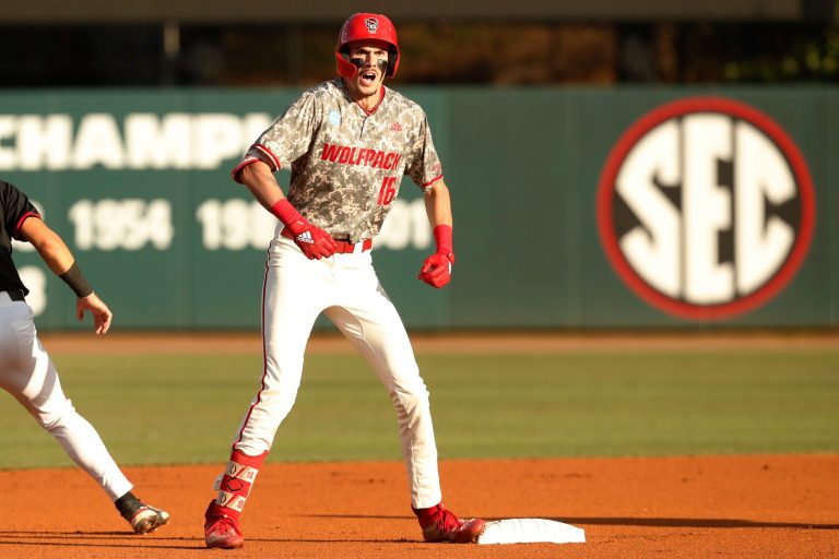 NC State's Alex Sosa (16) celebrates after making it safe to second base during Game 3 of the Super NCAA Regional against Georgia at Foley Field on Monday, June 10, 2024 in Athens, Ga. NC State won 8-5.