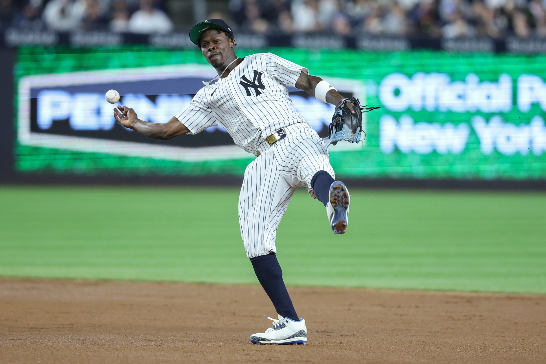 New York Yankees second baseman Jazz Chisholm Jr. (13) tries to make a running throw to first base in the fifth inning against the Kansas City Royals at Yankee Stadium. All players wore #42 for Jackie Robinson Day.