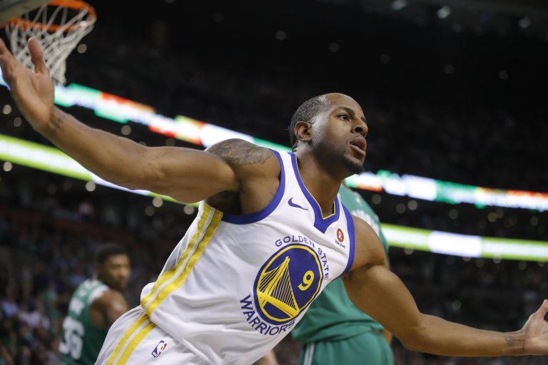 Golden State Warriors forward Andre Iguodala (9) reacts after scoring against the Boston Celtics in the second quarter at TD Garden