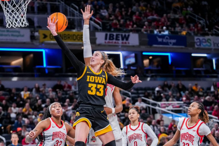 Iowa Hawkeyes guard Lucy Olsen (33) goes up for a basket Friday, March 7, 2025, in a quarterfinals game at the 2025 TIAA Big Ten Women's Basketball Tournament between the Iowa Hawkeyes and the Ohio State Buckeyes at Gainbridge Fieldhouse in Indianapolis. The Buckeyes defeated the Hawkeyes, 60-59.