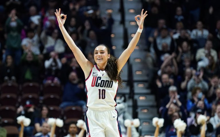 UConn Huskies guard Nika Muhl (10) reacts after a three point basket against the Georgetown Hoyas in the first half at Mohegan Sun Arena.