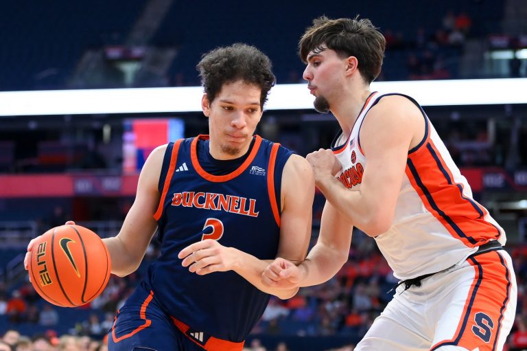 Bucknell Bison center Noah Williamson (3) drives against Syracuse Orange forward Petar Majstorovic (right) during the second half at the JMA Wireless Dome.