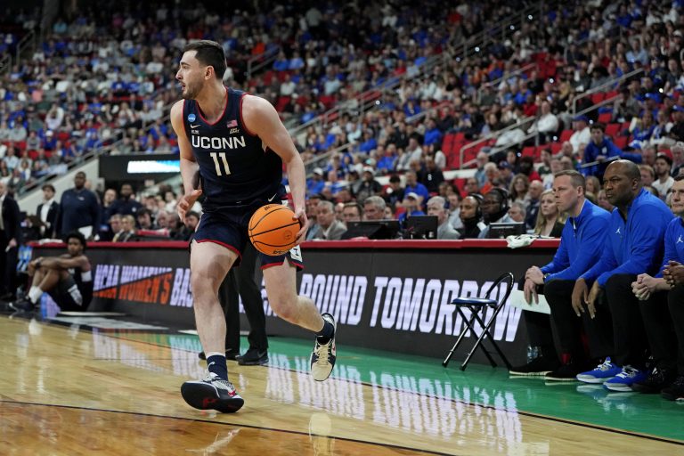 Connecticut Huskies forward Alex Karaban (11) drives to the basket during the first half against the Florida Gators in the second round of the NCAA Tournament at Lenovo Center.