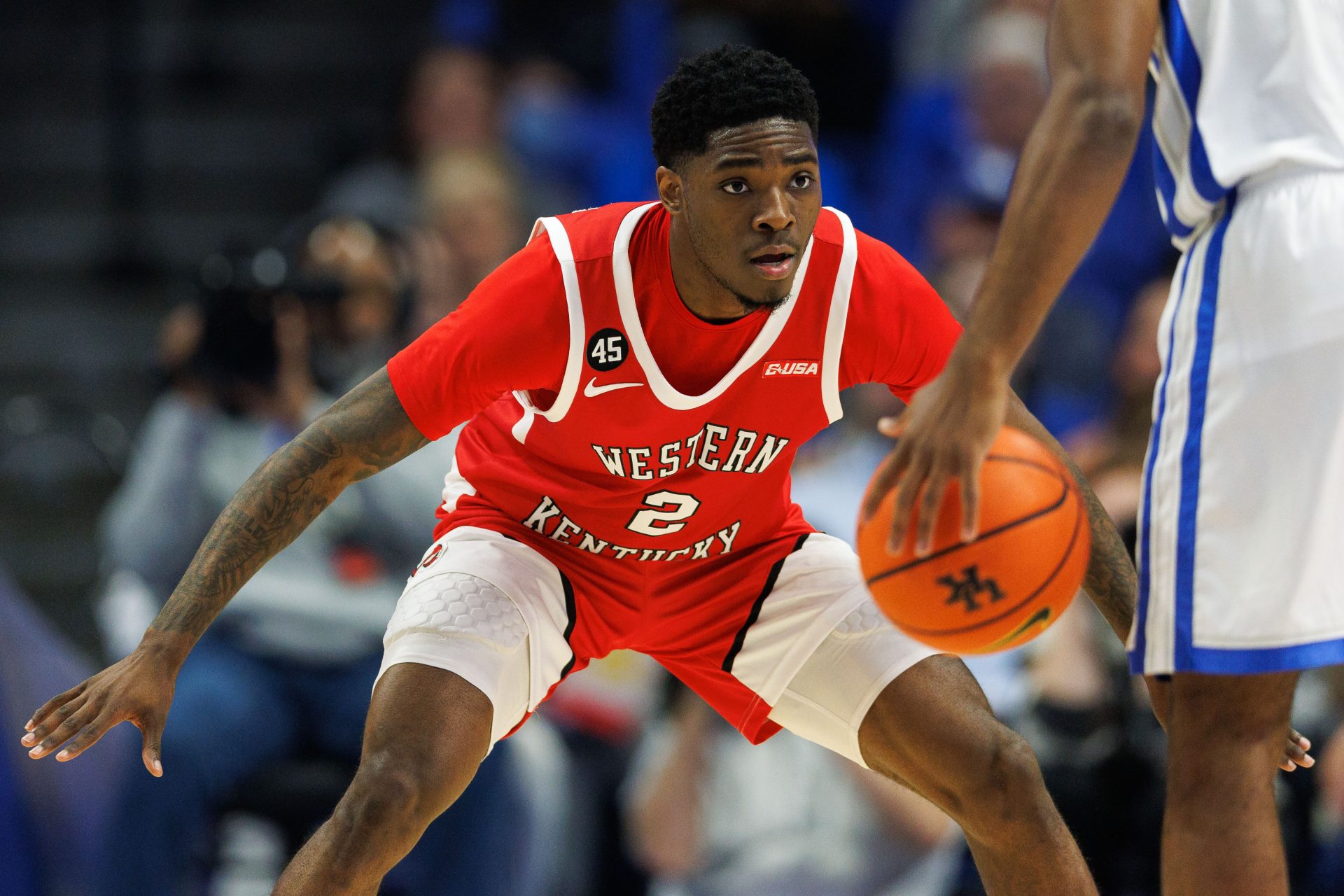 Western Kentucky Hilltoppers guard Don McHenry (2) defends during the first half against the Kentucky Wildcats at Rupp Arena at Central Bank Center.