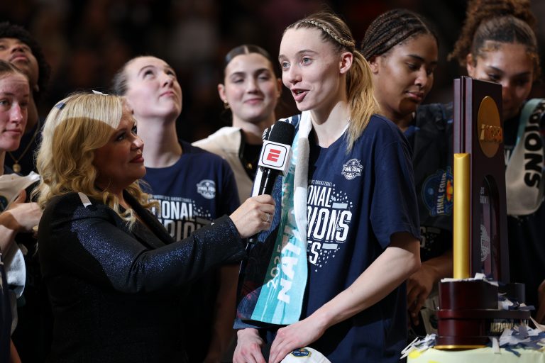 Connecticut Huskies guard Paige Bueckers (5) is interviewed by ESPN reporter Holly Rowe after the national championship of the women's 2025 NCAA tournament against the South Carolina Gamecocks at Amalie Arena.
