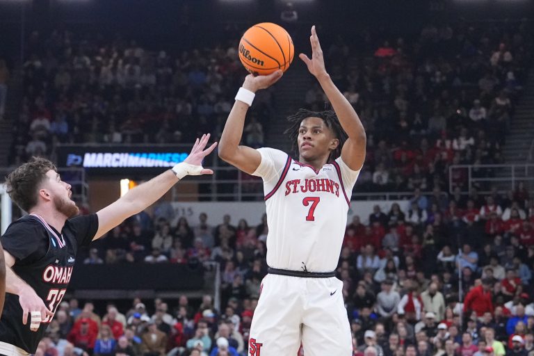 St. John's Red Storm guard Simeon Wilcher (7) controls the ball against Omaha Mavericks guard Tony Osburn (32) during the first half at Amica Mutual Pavilion.