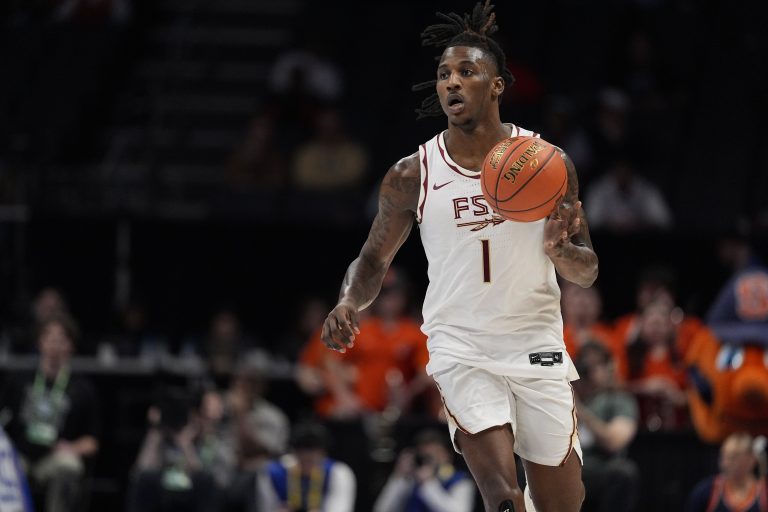 Florida State Seminoles guard Jamir Watkins (1) brings the ball up court against the Syracuse Orange during the second half at Spectrum Center.