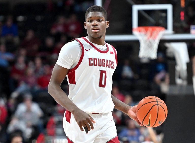 Washington State Cougars guard Cedric Coward (0) controls the ball against the Eastern Washington Eagles in the second half at Spokane Veterans Memorial Arena