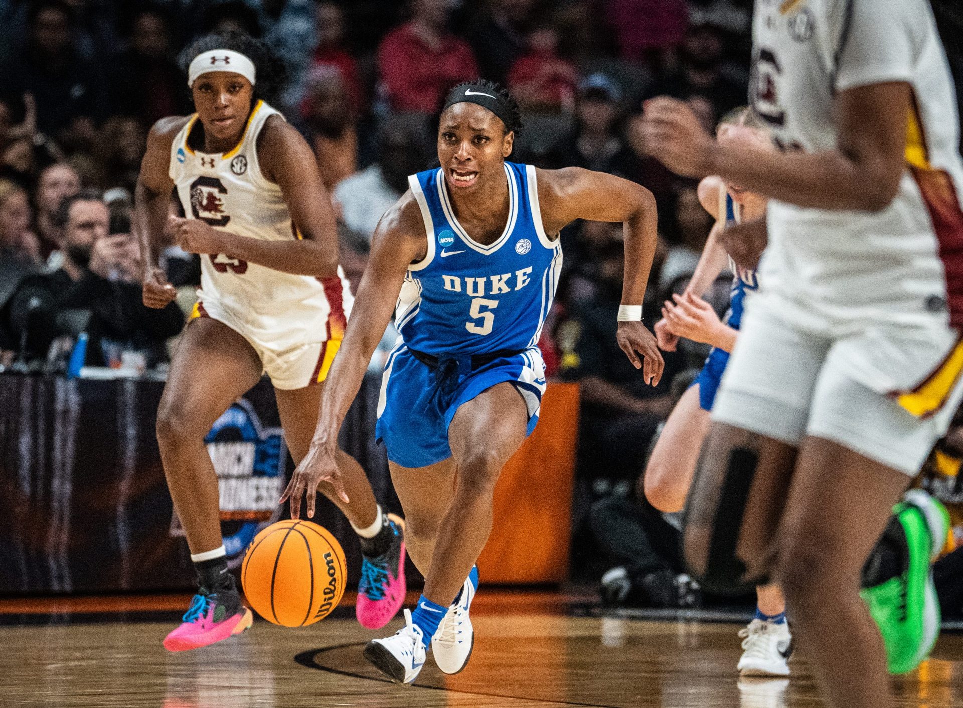 Duke Blue Devils guard Oluchi Okananwa (5) brings the ball down during the second half of the NCAA Regional Final game