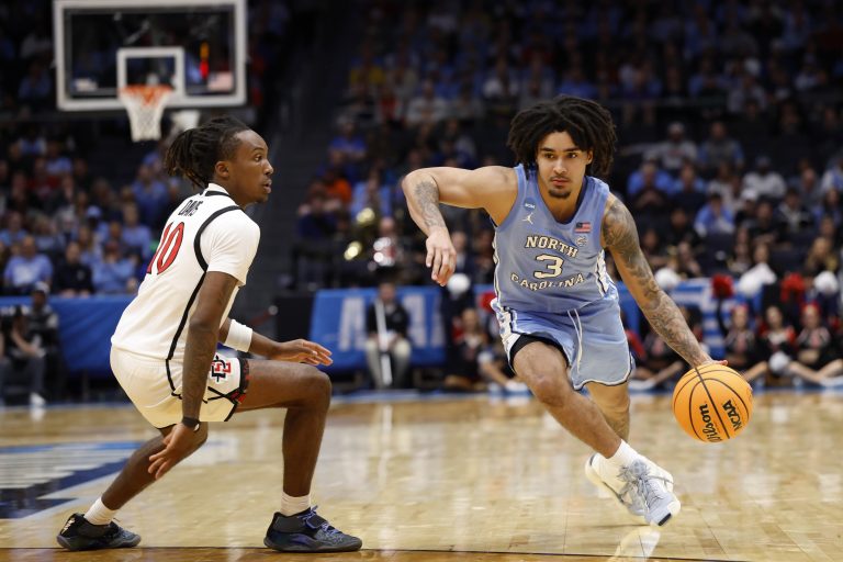 North Carolina Tar Heels guard Elliot Cadeau (3) dribbles the ball defended by San Diego State Aztecs guard BJ Davis (10) in the second half at UD Arena.